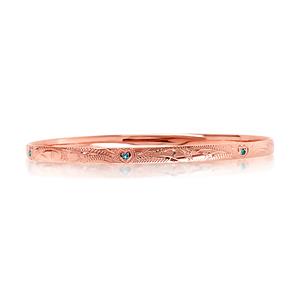 Solid bangle, 4.4mm wide, half round profile. Inner set 6 x 1.5mm London Topaz. 9ct approx weight 12.4gms, 67x57mm diameter.